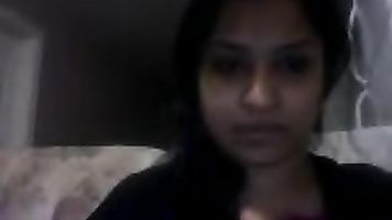 Sweet Noida girl Angel sitting naked on webcam pressing her boob and fingering her hairy pussy.