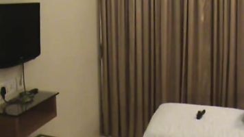 Indian wife on honeymooon trying different lingerie in front of her husband in hotel room who is filming her naked!. video2porn2